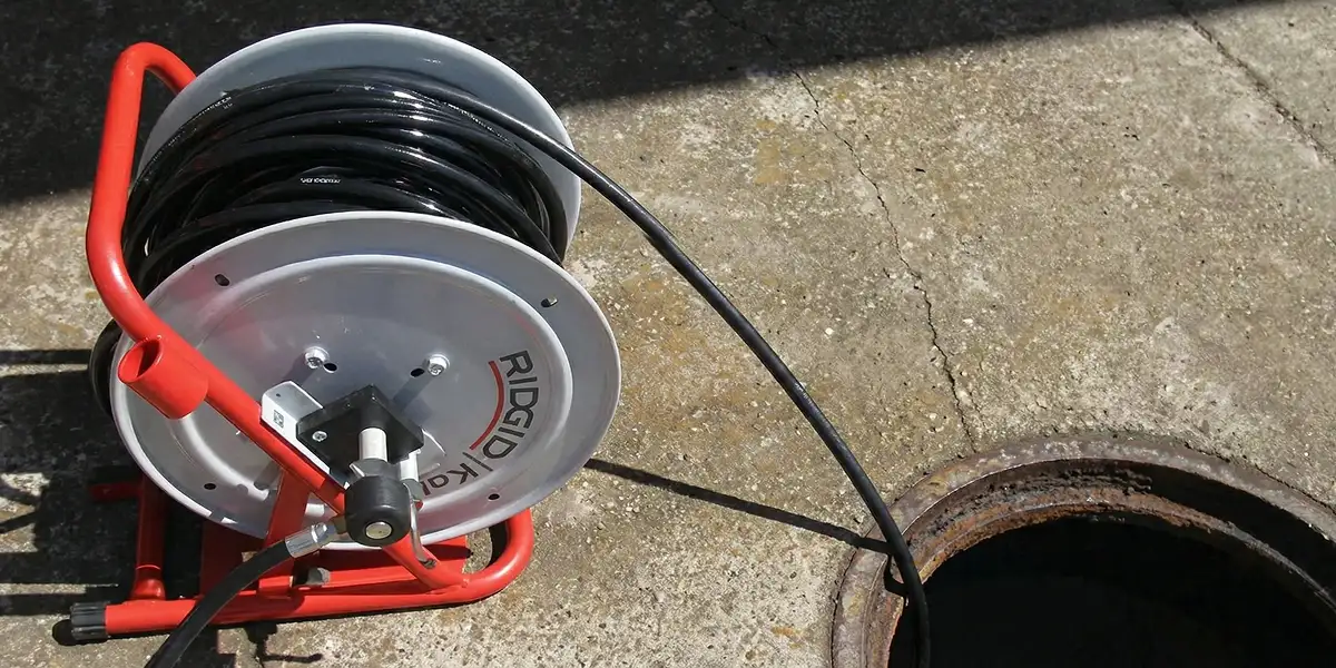 sewer rodding equipment prepared to clear clogged sewer lines in Orange, CA